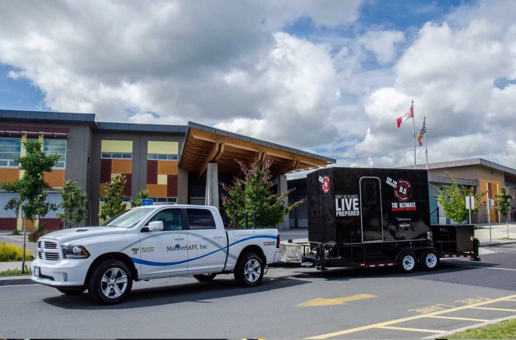 Truck pulling QuakeCottage trailer